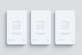 Three blank white smartphone screens in a row on a light gray background Royalty Free Stock Photo