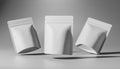 Three Blank White Stand-Up Pouches on Gray Background Royalty Free Stock Photo