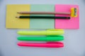 Three block notes  two pencils and three colorful marker pens Royalty Free Stock Photo