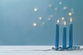 Three Blue Candles Burning Bright on a Table. Holiday, Celebration, or Memorial Background AI Image Royalty Free Stock Photo