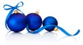 Three Blue Christmas balls with ribbon bow Isolated on white Royalty Free Stock Photo