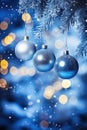 Three Blue Christmas Ornaments Hanging From a Tree Royalty Free Stock Photo