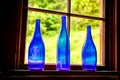 Three Blue Glass Bottles