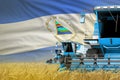 three blue modern combine harvesters with Nicaragua flag on farm field - close view, farming concept - industrial 3D illustration