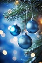 Three Blue Ornaments Hanging From a Christmas Tree Royalty Free Stock Photo