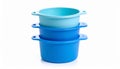 Stacked blue plastic containers with handles on a clean white background Royalty Free Stock Photo