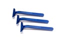 Three blue razors isolated on a white background Royalty Free Stock Photo