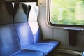 Three blue seats in modern European train