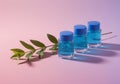 Three Blue Skincare Bottles Placed Next To Green Leaf Branch Royalty Free Stock Photo