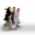 Three blurred persons running