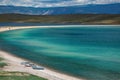 Three boats on the beach of Baikal lake