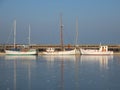 Three Boats in Frozen Cold Harbor Water at Wintertime