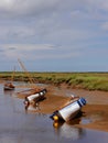 Three boats in gorgeous Blakeney, North Norfolk coast, East Anglia, UK Royalty Free Stock Photo