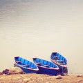 Three boats on the lake with retro filter Royalty Free Stock Photo