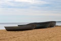 Three boats standing on the sand by the sea. Beautiful sky on a sunny day. Boats for tourists on the sea Royalty Free Stock Photo