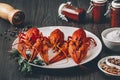 Three boiled fresh crawfish in white plate with green herbs Royalty Free Stock Photo