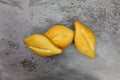 Three bolillo bread rolls on a gray mottled background Royalty Free Stock Photo