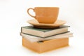 Three books and cup of tea/coffee Royalty Free Stock Photo