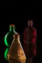 Three bottles on black background Royalty Free Stock Photo