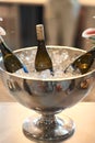 Three bottles of champagne in more often with ice