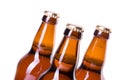 Three bottles of ice cold beer isolated on white Royalty Free Stock Photo