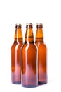 Three bottles of ice cold beer isolated on white Royalty Free Stock Photo