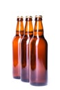 Three bottles of ice cold beer isolated on white Royalty Free Stock Photo