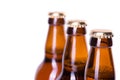 Three bottles of ice cold beer isolated on white Royalty Free Stock Photo