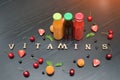 Three bottles of juice, the inscription Vitamins and fruits. Woo Royalty Free Stock Photo