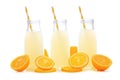 Three bottles of lemonade with lemon slices and straws isolated Royalty Free Stock Photo