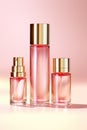 Three bottles of perfume on a pink background