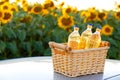 Three bottles of sunflower oil in a wicker basket Royalty Free Stock Photo