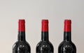 Three bottles of wine with red corks Royalty Free Stock Photo