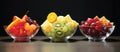 Three bowls of assorted fruit displayed on a table Royalty Free Stock Photo