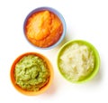 Three bowls of baby puree on white from above Royalty Free Stock Photo