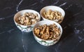 Three bowls of Christmas godies on the table.