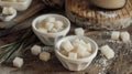 Three bowls sugar cubes wooden table Royalty Free Stock Photo