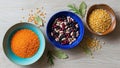 Three bowls on a wooden surface feature different types of legumes Royalty Free Stock Photo
