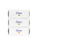 Three boxes of Dove Beauty Bar with moisturizing cream for sensitive skin close-up on a white background with copy space