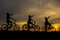 Three boys cycling along the front