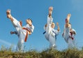 Three boys in karategi beats punch mae geri