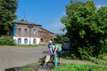 Three boys playing with a public water tap. Suzdal, Russia Royalty Free Stock Photo