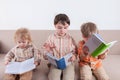 Three boys are reading books concept of intelligence Royalty Free Stock Photo