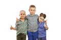 Three boys are standing together on the white background and hold their thumbs up Royalty Free Stock Photo