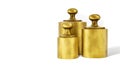 Three brass weights on white background