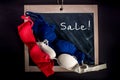 Three brassieres lying on the chalkboard sale Royalty Free Stock Photo