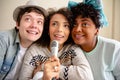 Three brazilian multiracial friends singing karaoke. Playful youth, enjoyment situation