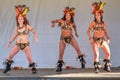 Three Brazilian samba dancers giving a lively performance