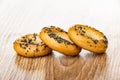 Bread rings sushka with poppy seeds on wooden table Royalty Free Stock Photo