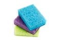 Three bright colored sponges for sanitary work, washing dishes, cleaning the bathroom and other household needs. The need for Royalty Free Stock Photo